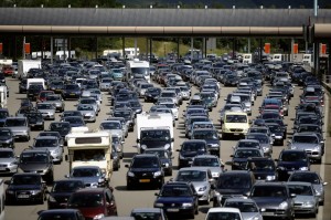 Vehicles leave after queuing up at the "